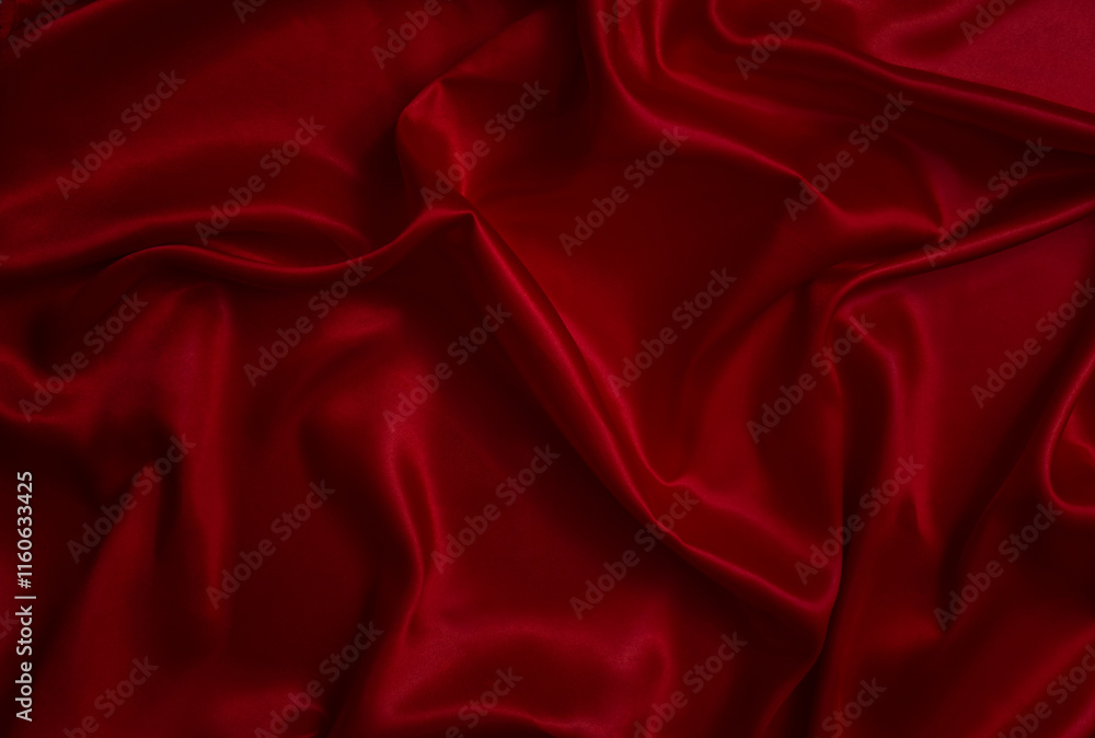 The top view of the red satin surface looks luxurious and beautiful. with sparkling waves Abstract background design copy space Card or banner (blurred or blurry) The top view of the red satin surface looks luxurious and beautiful. with sparkling waves Abstract background design copy space Card or banner (blurred or blurry)