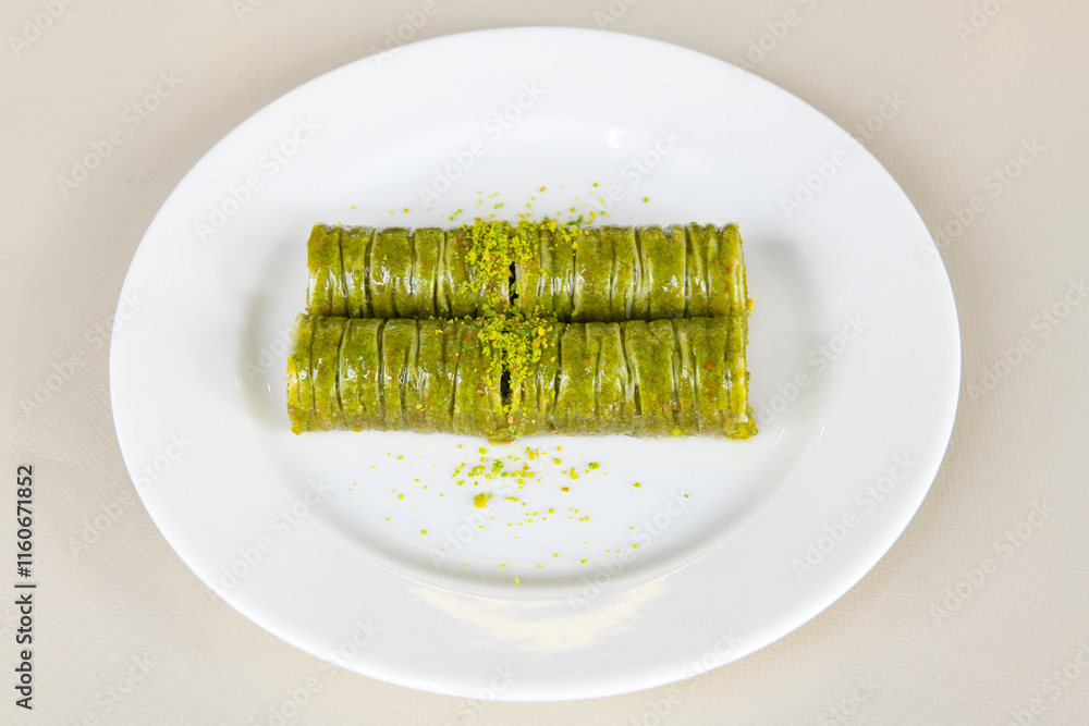Turkish Dessert Sobiyet, havuc dilimi, midye baklava, mussels baklava and classic baklava with Pistachio . Cikolatali cevizli, fistikli soguk Baklava, top view. Turkish Dessert Sobiyet, havuc dilimi, midye baklava, mussels baklava and classic baklava with Pistachio . Cikolatali cevizli, fistikli soguk Baklava, top view.