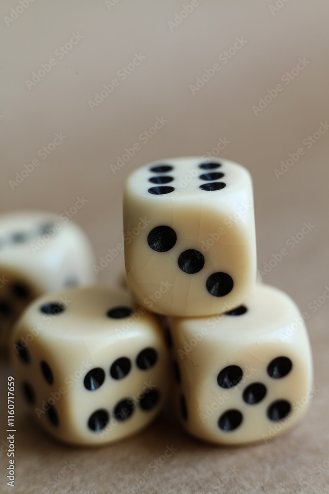 dice on a beige background, close-up 