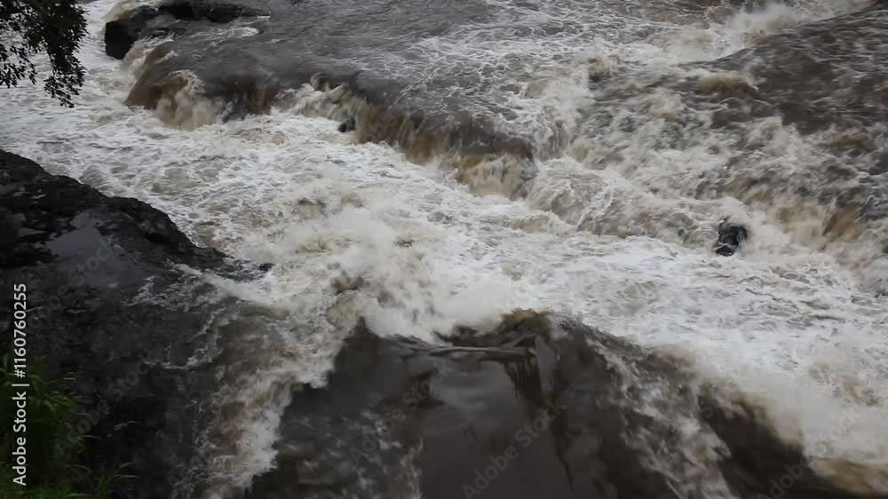 Waterfall on the river in the rainy season. Spring flood. Waterfall on the river in the rainy season. Spring flood.