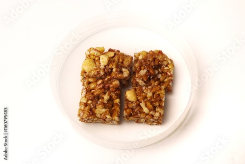 Jipang or berondong is indonesian traditional snack. Made from rice, corn coated with sweet caramel. Isolated white background photo