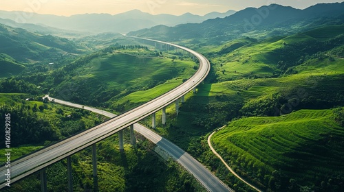 Serene Highway Winding Through Lush Mountainous Landscape. A Breathtaking Aerial View of a Scenic Route. photo