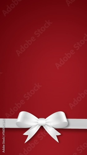 Elegant white bow and ribbon animation on a deep red gradient background. Perfect for valentines day concept, birthday, wedding, anniversary, christmas, gift cards and romantic moments