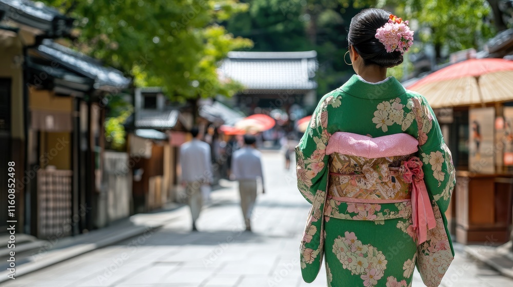 Woman in Traditional Japanese Kimono Walking Through a Street Woman in Traditional Japanese Kimono Walking Through a Street