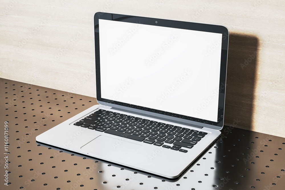 Modern open laptop with blank white screen on a metallic perforated table in a clean, bright setting. 3D Rendering Modern open laptop with blank white screen on a metallic perforated table in a clean, bright setting. 3D Rendering
