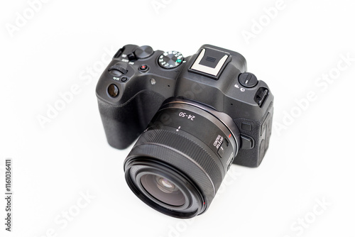 Interchangeable lens digital professional camera for photography and videography on white isolated background photo