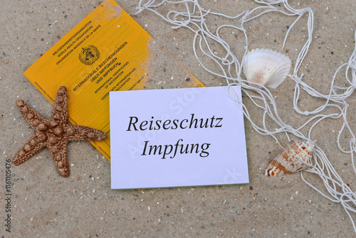 Notizblock mit Impfausweis und dem Text Reiseschutzimpfung. photo