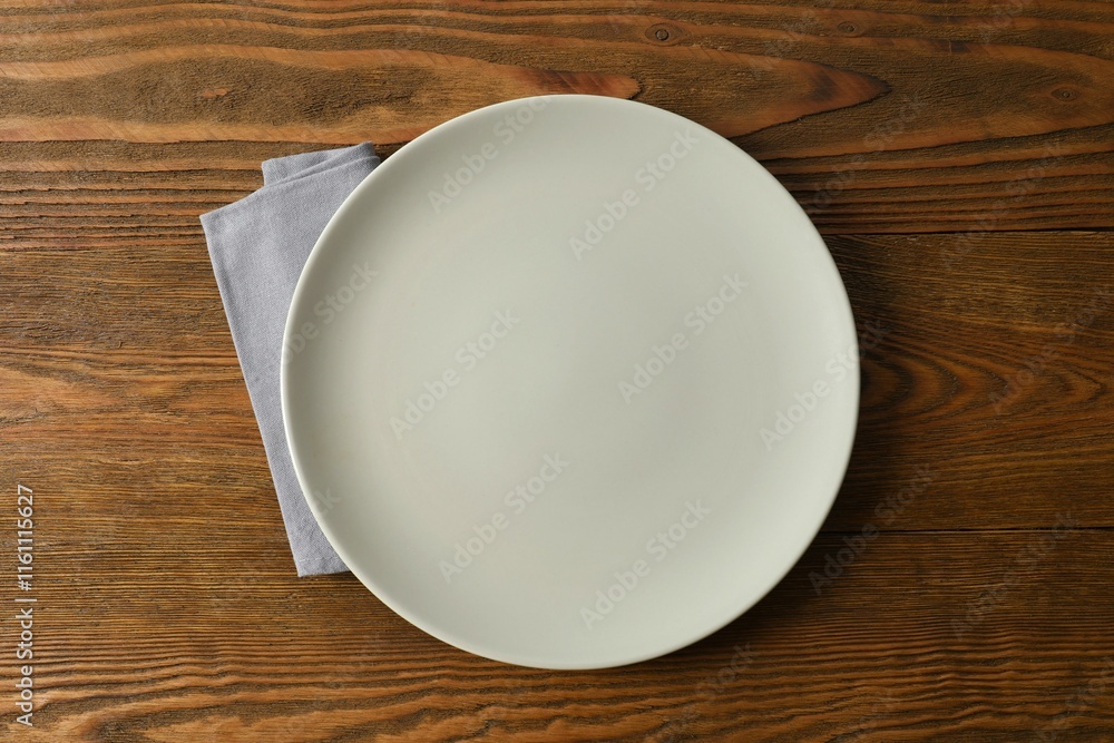 Empty round plate on wooden background, top view Empty round plate on wooden background, top view