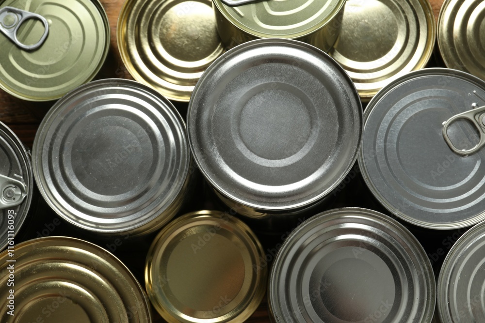 Hard cans of food on a wooden background Hard cans of food on a wooden background