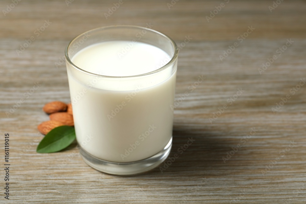 Glass of almond milk on the table Glass of almond milk on the table