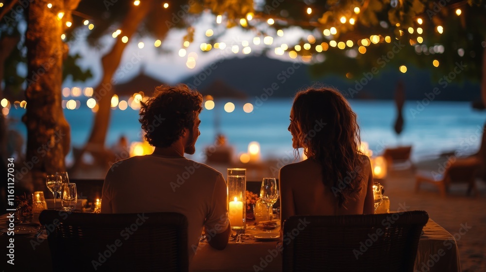 Romantic dinner setting by the beach under twinkling lights at sunset Romantic dinner setting by the beach under twinkling lights at sunset