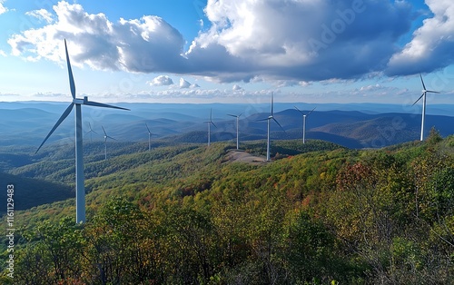 A stunning view of wind turbines standing tall on a scenic hillside, surrounded by lush greenery and distant mountains under a vibrant blue sky, representing clean energy and susta photo