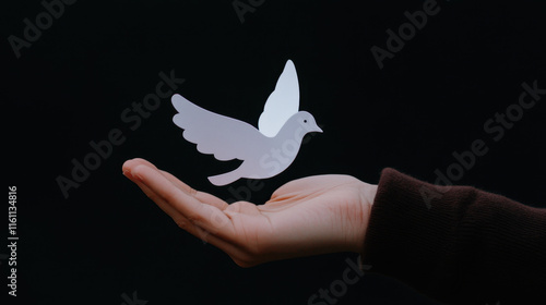 Humanitarian, A hand holds a frayed paper dove, symbolizing peace and fragility, captured in this detailed PNG image suitable for various creative projects. photo