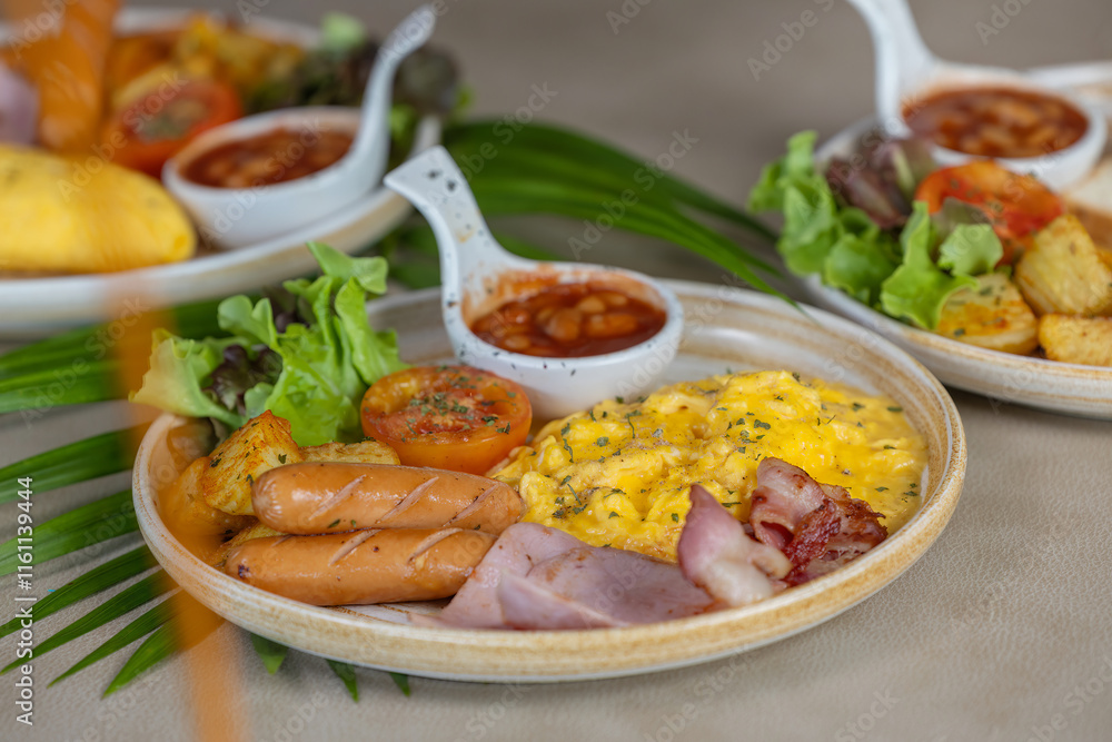 Breakfast with fried eggs and bacon and sausage. Breakfast set at hotel. Hearty Traditional Breakfast Plate with Eggs, Sausage, Bacon, Toast, and Vegetable Salad. Breakfast with fried eggs and bacon and sausage. Breakfast set at hotel. Hearty Traditional Breakfast Plate with Eggs, Sausage, Bacon, Toast, and Vegetable Salad.