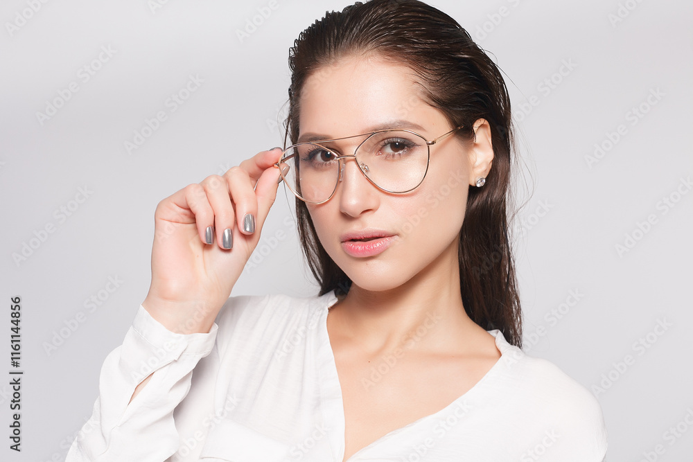 Pretty young girl in white blank t-shirt, wearing glasses Pretty young girl in white blank t-shirt, wearing glasses
