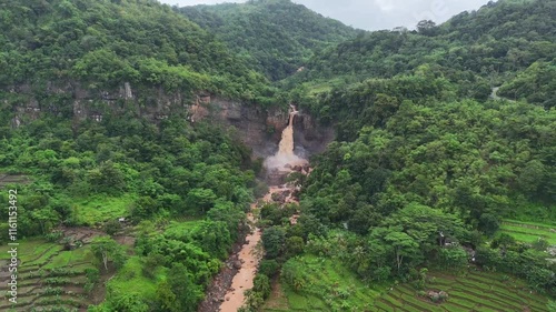 Amazing Waterfall in Sukabumi, a destination for many tourists as a place for recreation and photos. beautiful natural panorama of Waterfall Geopark Ciletuh
 photo