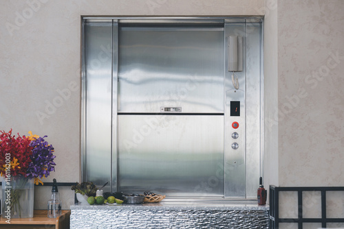 Dumbwaiter Lift elevator in a kitchen of Restaurant or Hotel used for carrying food or goods. Food hoist and food elevator for ready meals. Small Freight Elevators or Dumbwaiters Food Elevators