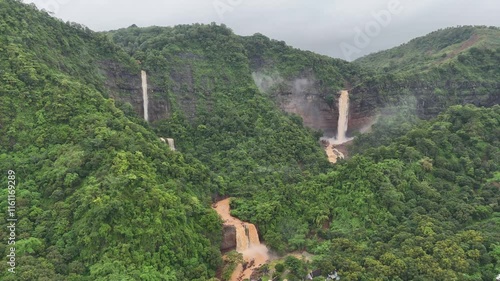 Amazing Waterfall in Sukabumi, a destination for many tourists as a place for recreation and photos. beautiful natural panorama of Waterfall Geopark Ciletuh
 photo