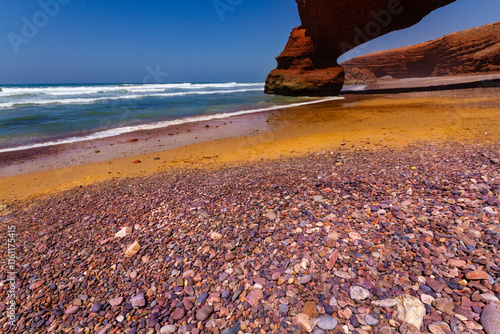 A beautiful beach and natural red arch on the Atlantic Ocean coast. Legzira Beach (or Lagzira, or Gzira). Sidi Ifni, Morocco, Africa