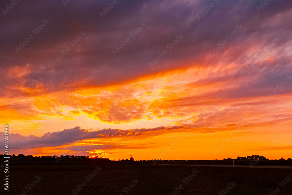Sunset with dramatic clouds near Forstern, Moos, Isar, Deggendorf, Bavaria, Germany Sunset with dramatic clouds near Forstern, Moos, Isar, Deggendorf, Bavaria, Germany