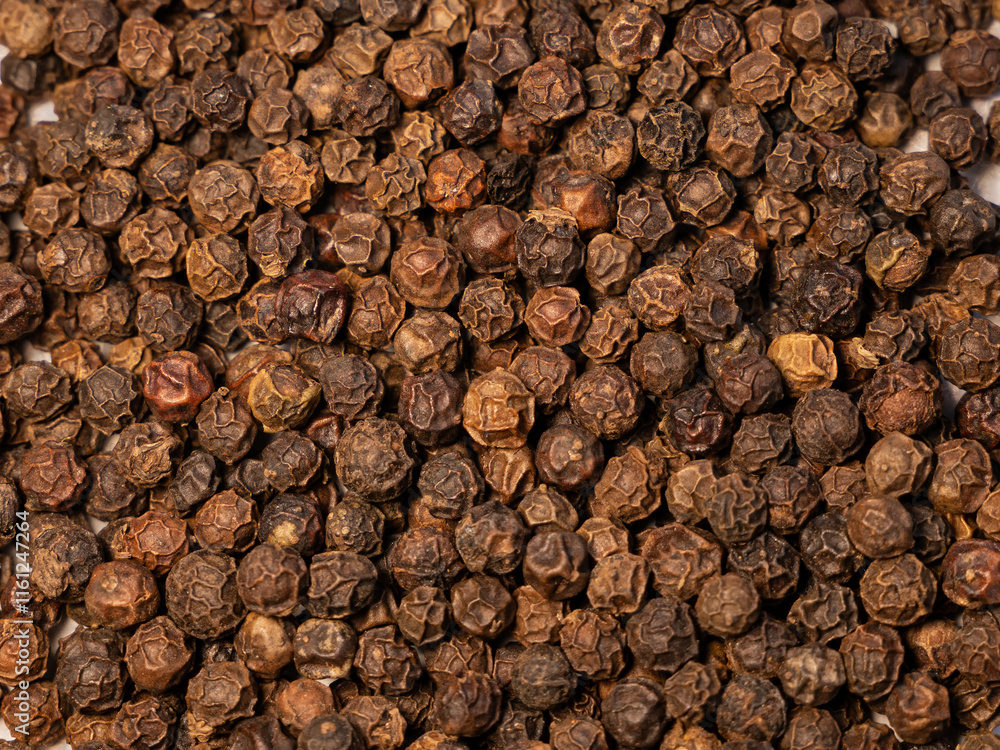 Black peppercorns. Spice close-up. The selected sharpness. round black pepper background Black peppercorns. Spice close-up. The selected sharpness. round black pepper background