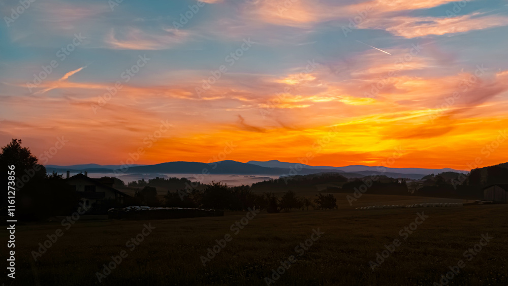Foggy sunrise with dramatic clouds near Kirchberg im Wald, Regen, Bavarian Forest, Bavaria, Germany Foggy sunrise with dramatic clouds near Kirchberg im Wald, Regen, Bavarian Forest, Bavaria, Germany