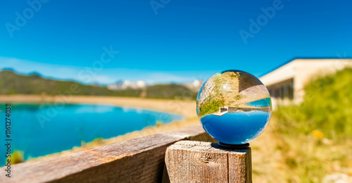 Crystal ball alpine summer landscape shot at Mount Flimjoch, Ischgl, Paznaun, Silvretta, Landeck, Tyrol, Austria photo