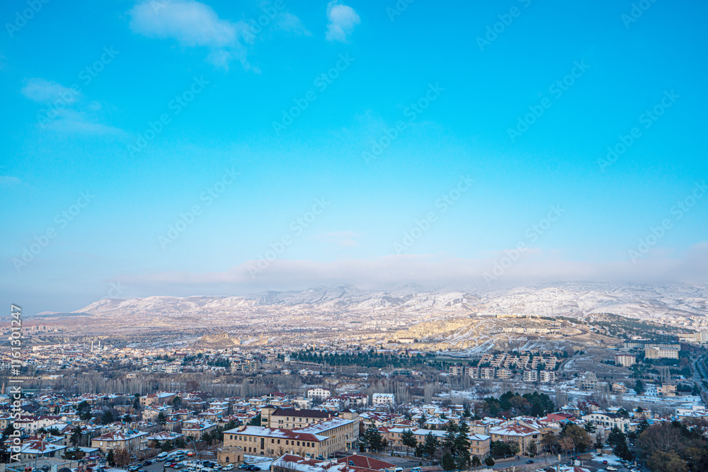 Fototapeta premium The scenic views of Ürgüp from Temenni Hill, which is located in the center of Ürgüp. Revealing the city panorama with its height of 80 meters, this rocky hill, can be seen from all over Ürgüp.