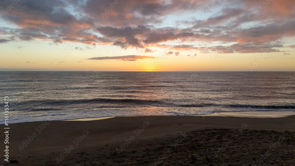 Drone aerial view of a sunset on a beach near Peniscola in Spain. Drone aerial view of a sunset on a beach near Peniscola in Spain.