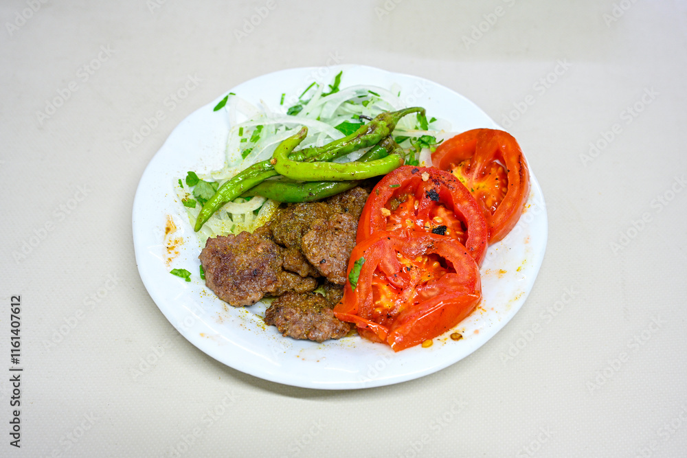 Meatball between bread (Turkish name : ekmek arasi kofte ) Izgara kofte. Manisa, Akcaabat, Akhisar kofte. Delicious meat grilled meatballs. Meatball between bread (Turkish name : ekmek arasi kofte ) Izgara kofte. Manisa, Akcaabat, Akhisar kofte. Delicious meat grilled meatballs.