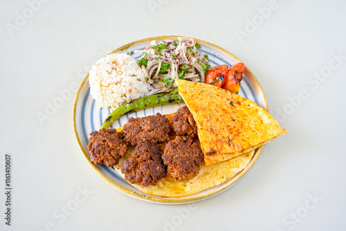 Meatball between bread (Turkish name : ekmek arasi kofte ) Izgara kofte. Manisa, Akcaabat, Akhisar  kofte. Delicious meat grilled meatballs. photo