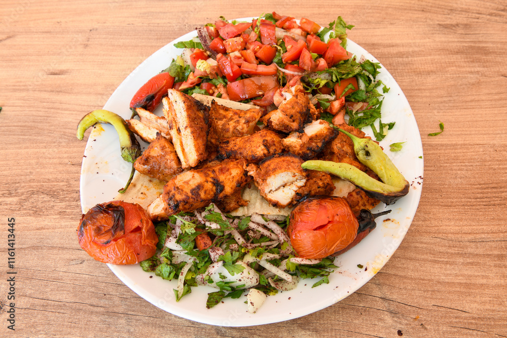 Chicken wings barbeque in a dish with BBQ grill sauce . Izgara tavuk kelebek sis kanat. Tavuk sis, gogus. Chicken wings barbeque in a dish with BBQ grill sauce . Izgara tavuk kelebek sis kanat. Tavuk sis, gogus.