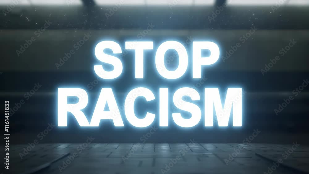 A neon sign that says Stop Racism. It is lit up in a dark room. The sign is in the center of the image A neon sign that says Stop Racism. It is lit up in a dark room. The sign is in the center of the image