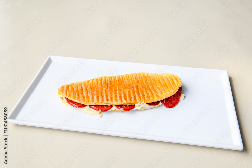 Turkish karisik atom kare  tost ( kasarli bazlama tost) . Sucuklu, Kasarli,  cheddarli, kavurmali karisik tost. Flat baked bread toasted. Karisik bazlama tost .