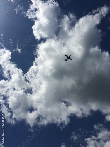 big plane in the sky clouds