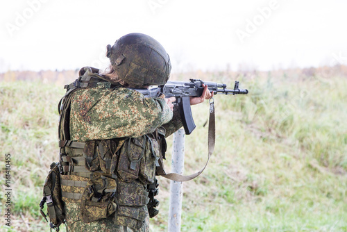 Man shooting at a target. Unformal shooting range photo