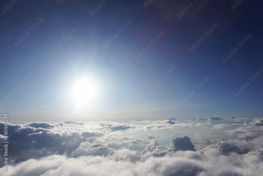 Naklejka premium background of blue sky with sun and clouds. Clouds and sun over the sky. Beautiful sunset