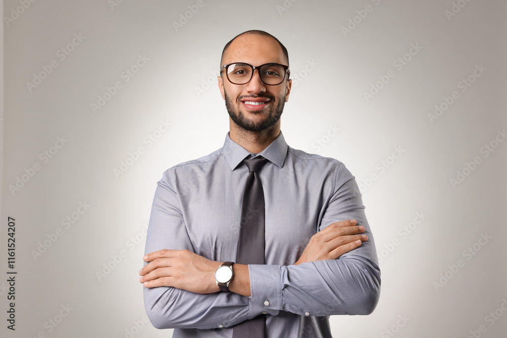 Portrait of businessman in glasses on light gray background Portrait of businessman in glasses on light gray background
