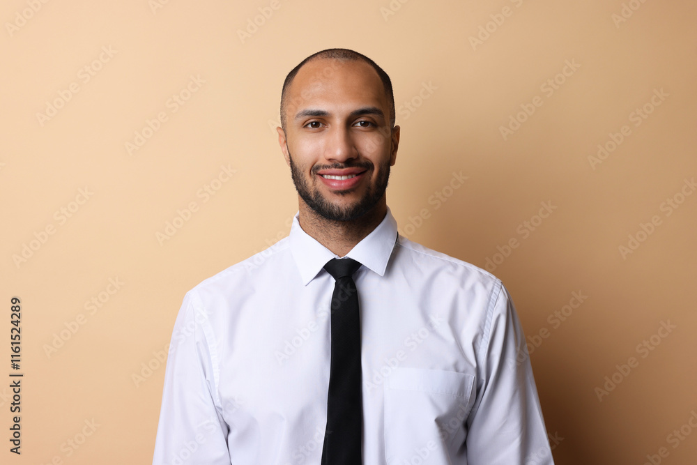 Portrait of businessman with necktie on beige background Portrait of businessman with necktie on beige background