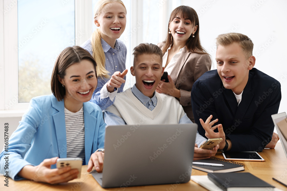 Group of people using different gadgets at wooden table in office. Modern technology Group of people using different gadgets at wooden table in office. Modern technology