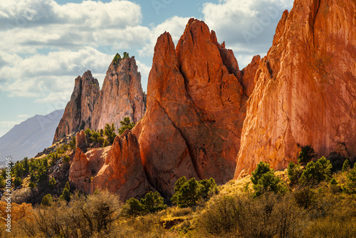 2024-12-21 MULTI COLORED JAGGED ROCK FORMATIONS AND A NICE CLOUDY SKY AT THE GARDEN OF THE GODS IN COLORADO SPRINGS COLORADO