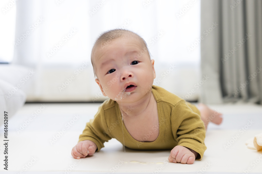 Baby relaxing on soft mat for tummy time Baby relaxing on soft mat for tummy time