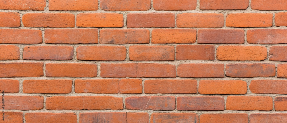 Worn brick wall with subtle texture and traces of old plaster, showcasing rustic charm Worn brick wall with subtle texture and traces of old plaster, showcasing rustic charm