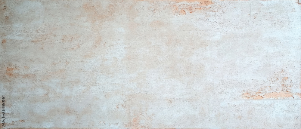 Fototapeta premium Worn wall with subtle textures and traces of old plaster, creating rustic feel