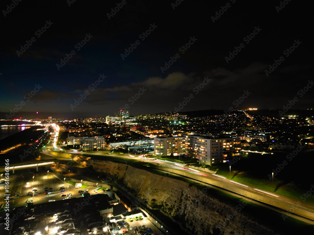 Fototapeta premium Aerial View of Illuminated Brighton Beach and Ocean City and British Tourist Attraction of East Sussex, England Great Britain During Night. Drone's Camera Footage Captured on December 3rd, 2024