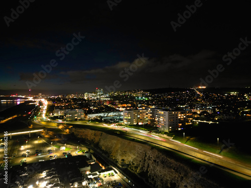 Aerial View of Illuminated Brighton Beach and Ocean City and British Tourist Attraction of East Sussex, England Great Britain During Night. Drone's Camera Footage Captured on December 3rd, 2024 photo