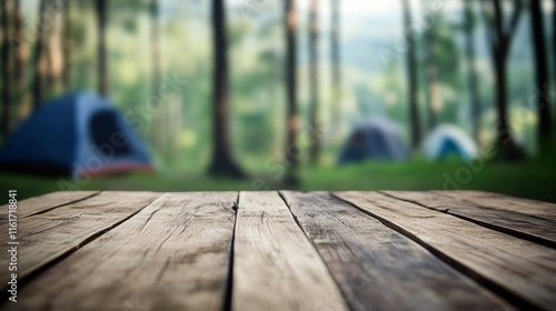 Wood table and Blurred camping and tents in forest.