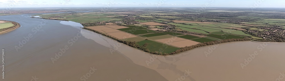 Aerial view of a river delta with agricultural fields and lush green landscapes. Aerial view of a river delta with agricultural fields and lush green landscapes.