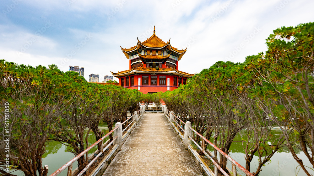 Naklejka premium Buddhist temple with a bridge over the lake in Yunnan Province