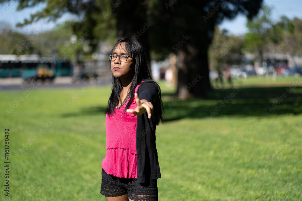 Transgender woman making an objection with her hand. Transgender woman making an objection with her hand.